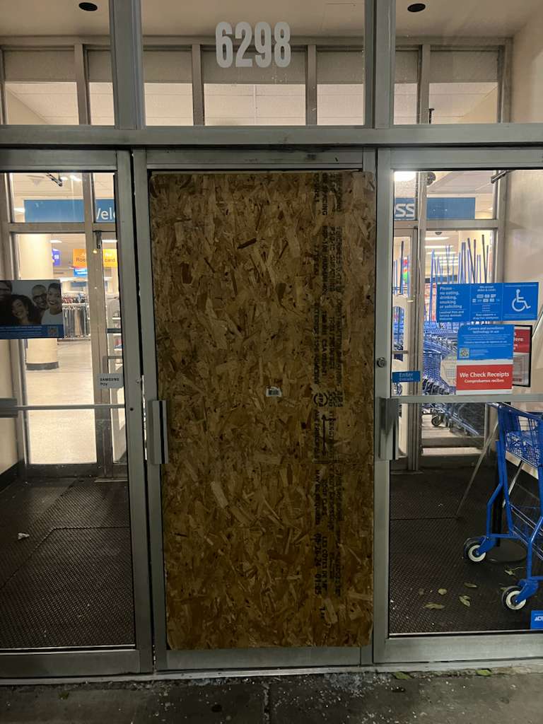 Boarded commercial entrance after glass damage